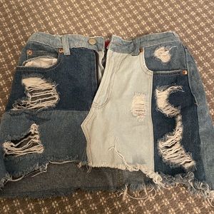 Signature 8 color patch distressed mini denim skirt